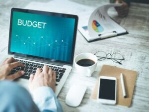 Insight into Managed IT Services Costs Photo of person budgeting on laptop